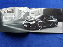 Lade das Bild in den Galerie-Viewer, Porsche Cayman S Black Edition MJ 2012 - Hardcover Prospekt + Preisliste 05.2011