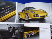 Lade das Bild in den Galerie-Viewer, Porsche Exclusive 911 Cayenne Boxster Cayman MJ 2006 - Hardcover Prospekt 8.2005
